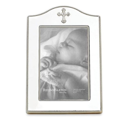 Showcasing a centered cross, the Abbey Picture Frame from Reed & Barton is an extravagantly detailed gift for any religious event. Inspired by ornate designs of elegant abbeys, this silverplate picture frame features an arched top and beaded border. Elegantly packaged for gift-giving.
