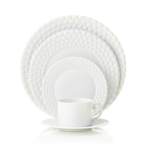 9"  Inspired by the art of the ancient Greeks, L'Objet's Aegean Sculpted dinnerware is edged with three layers of beautiful scales. Each plate is made by hand from Limoges porcelain. Five-piece settings include dinner plate, dessert plate, bread and butter plate, tea cup, and saucer.